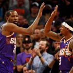 Mar 3, 2024; Phoenix, Arizona, USA; Phoenix Suns forward Kevin Durant (35) celebrates with guard Bradley Beal (3) during the first quarter of the game against the Oklahoma City Thunder at Footprint Center.