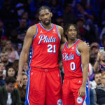 Apr 12, 2024; Philadelphia, Pennsylvania, USA; Philadelphia 76ers center Joel Embiid (21) and guard Tyrese Maxey (0) stand together during a break in action in the fourth quarter against the Orlando Magic at Wells Fargo Center.