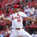 Jun 26, 2024; St. Louis, Missouri, USA; St. Louis Cardinals relief pitcher Giovanny Gallegos (65) pitches against the Atlanta Braves during the eighth inning at Busch Stadium. Mandatory Credit: Jeff Curry-USA TODAY Sports