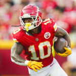 Sep 15, 2024; Kansas City, Missouri, USA; Kansas City Chiefs running back Isiah Pacheco (10) runs the ball during the first half against the Cincinnati Bengals at GEHA Field at Arrowhead Stadium. Mandatory Credit: Jay Biggerstaff-Imagn Images