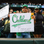 Sep 29, 2024; Seattle, Washington, USA; An Oakland Athletics fan holds a sign after the game between the Seattle Mariners and the Oakland Athletics at T-Mobile Park.