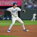 MLB- Oct 9, 2024; Kansas City, Missouri, USA; Kansas City Royals shortstop Bobby Witt Jr. (7) fields a ball in the third inning against the New York Yankees during game three of the NLDS for the 2024 MLB Playoffs at Kauffman Stadium. Mandatory Credit: Peter Aiken-Imagn Images