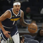 Oct 17, 2024; Minneapolis, Minnesota, USA; Denver Nuggets forward Michael Porter Jr. (1) brings the ball up court against the Minnesota Timberwolves in the first quarter at Target Center.