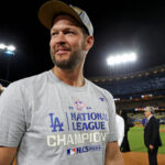 Oct 20, 2024; Los Angeles, California, USA; Los Angeles Dodgers pitcher Clayton Kershaw (22) celebrates after beating the New York Mets during game six of the NLCS for the 2024 MLB playoffs at Dodger Stadium. Mandatory Credit: Kiyoshi Mio-Imagn Images