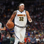 Oct 24, 2024; Denver, Colorado, USA; Denver Nuggets forward Aaron Gordon (32) controls the ball in the second half against the Oklahoma City Thunder at Ball Arena.