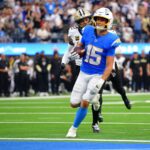 Oct 27, 2024; Inglewood, California, USA; Los Angeles Chargers wide receiver Ladd McConkey (15) runs the ball for a touchdown against the New Orleans Saints during the second half at SoFi Stadium. Mandatory Credit: Gary A. Vasquez-Imagn Images