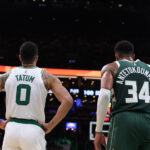 Oct 28, 2024; Boston, Massachusetts, USA; Boston Celtics forward Jayson Tatum (0) and Milwaukee Bucks forward Giannis Antetokounmpo (34) look on during the second half at TD Garden.