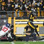 Oct 28, 2024; Pittsburgh Steelers wide receiver George Pickens (14) catches a 50-yard pass in front of New York Giants safety Jason Pinnock (27) during the fourth quarter at Acrisure Stadium. Mandatory Credit: Barry Reeger-Imagn Images