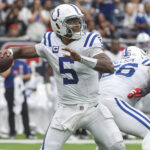 Oct 27, 2024; Houston, Texas, USA; Indianapolis Colts quarterback Anthony Richardson (5) looks for an open receiver during the game against the Houston Texans at NRG Stadium. Mandatory Credit: Troy Taormina-Imagn Images