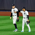 Oct 30, 2024; Bronx, New York, USA, MLB; New York Yankees outfielder Juan Soto (22) reacts with outfielder Aaron Judge (99) after Judge dropped a fly ball during the fifth inning against the Los Angeles Dodgers during game five of the 2024 MLB World Series at Yankee Stadium. Mandatory Credit: James Lang-Imagn Images