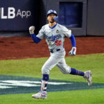 Oct 30, 2024; New York, New York, USA; Los Angeles Dodgers shortstop Mookie Betts (50) celebrates after hitting a sacrifice fly during the eighth inning against the New York Yankees in game four of the 2024 MLB World Series at Yankee Stadium. Mandatory Credit: Brad Penner-Imagn Images