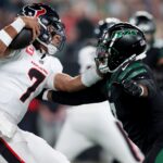 Oct 31, 2024; East Rutherford, New Jersey, USA; Houston Texans quarterback C.J. Stroud (7) is pressured by New York Jets defensive end Haason Reddick (7) during the first quarter at MetLife Stadium. Mandatory Credit: Brad Penner-Imagn Images