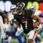Nov 3, 2024; Atlanta, Georgia, USA; Atlanta Falcons running back Bijan Robinson (7) runs the ball against the Dallas Cowboys in the first quarter at Mercedes-Benz Stadium.