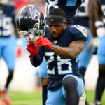 Nov 3, 2024; Nashville, Tennessee, USA; Tennessee Titans safety Quandre Diggs (28) slams his helmet down after an ankle injury against the New England Patriots during the first half at Nissan Stadium. Mandatory Credit: Steve Roberts-Imagn Images