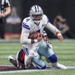 Nov 3, 2024; Atlanta, Georgia, USA; Dallas Cowboys quarterback Dak Prescott (4) is tackled from behind by Atlanta Falcons linebacker Kaden Elliss (55) during the second half at Mercedes-Benz Stadium. Mandatory Credit: Dale Zanine-Imagn Images