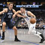 Nov 3, 2024; Dallas, Texas, USA; Dallas Mavericks guard Luka Doncic (77) brings the ball up court past Orlando Magic forward Franz Wagner (22) during the first quarter at American Airlines Center. Mandatory Credit: Jerome Miron-Imagn Images