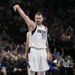 Nov 3, 2024; Dallas, Texas, USA; Dallas Mavericks guard Luka Doncic (77) poses after he makes a three point basket against the Orlando Magic during the second quarter at the American Airlines Center.