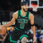 Nov 4, 2024; Atlanta, Georgia, USA; Boston Celtics forward Jayson Tatum (0) handles the ball against the Atlanta Hawks in the first quarter at State Farm Arena.