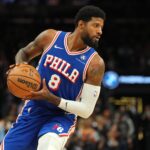 Nov 4, 2024; Phoenix, Arizona, USA; Philadelphia 76ers forward Paul George (8) protects the ball against the Phoenix Suns during the first half at Footprint Center. Mandatory Credit: Joe Camporeale-Imagn Images