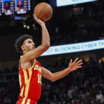 Nov 6, 2024; Atlanta, Georgia, USA; Atlanta Hawks forward Zaccharie Risacher (10) shoots against the New York Knicks during the second half at State Farm Arena.