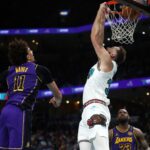 Nov 6, 2024; Memphis, Tennessee, USA; Memphis Grizzlies center Jay Huff (30) dunks during the second half against the Los Angeles Lakers at FedExForum. Mandatory Credit: Petre Thomas-Imagn Images