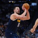 Nov 6, 2024; Denver, Colorado, USA; Denver Nuggets center Nikola Jokic (15) prepares to shoot the ball in the second half against the Oklahoma City Thunder at Ball Arena.