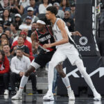 Nov 7, 2024; San Antonio, Texas, USA; Portland Trail Blazers forward Jerami Grant (9) and San Antonio Spurs center Victor Wembanyama (1) battle for position in the second half at Frost Bank Center. Mandatory Credit: Daniel Dunn-Imagn Images