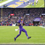 Nov 7, 2024; Baltimore, Maryland, USA; Baltimore Ravens quarterback Lamar Jackson (8) scores a two point conversion during the fourth quarter against the Cincinnati Bengals at M&T Bank Stadium. Mandatory Credit: Mitch Stringer-Imagn Images