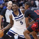 Nov 7, 2024; Chicago, Illinois, USA; Minnesota Timberwolves guard Anthony Edwards (5) drives to the basket against Chicago Bulls forward Julian Phillips (15) during the first half at United Center. Mandatory Credit: Kamil Krzaczynski-Imagn Images