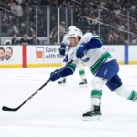 Nov 7, 2024; Los Angeles, California, USA; Vancouver Canucks right wing Brock Boeser (6) shoots the puck during the first period against the Los Angeles Kings at Crypto.com Arena. Mandatory Credit: Kiyoshi Mio-Imagn Images
