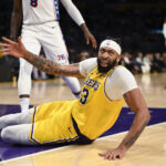 Nov 8, 2024; Los Angeles, California, USA; Los Angeles Lakers forward Anthony Davis (3) reacts after being fouled against the Philadelphia 76ers during the second half at Crypto.com Arena.