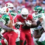 Nov 10, 2024; Glendale, Arizona, USA; Arizona Cardinals running back Trey Benson (33) runs against the New York Jets during the first half at State Farm Stadium. Mandatory Credit: Joe Camporeale-Imagn Images