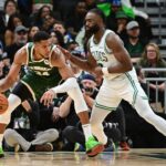 Nov 10, 2024; Milwaukee, Wisconsin, USA; Milwaukee Bucks forward Giannis Antetokounmpo (34) is guarded by Boston Celtics forward Jaylen Brown (7) in the fourth quarter at Fiserv Forum. Mandatory Credit: Benny Sieu-Imagn Images