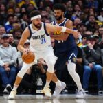 Nov 10, 2024; Denver, Colorado, USA; Dallas Mavericks guard Klay Thompson (31) and Denver Nuggets guard Jamal Murray (27) during the first quarter at Ball Arena.