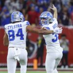 Nov 10, 2024; Houston, Texas, USA; Detroit Lions place kicker Jake Bates (39) celebrates with tight end Shane Zylstra (84) after kicking a field goal with time expiring to give the Lions a win over the Houston Texans at NRG Stadium.