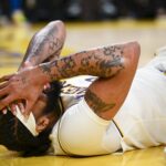 Nov 10, 2024; Los Angeles, California, USA; Los Angeles Lakers forward Anthony Davis (3) is injured against the Toronto Raptors during the second half at Crypto.com Arena.