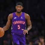 Nov 10, 2024; Los Angeles, California, USA; Toronto Raptors guard Immanuel Quickley (5) dribbles the ball against the Los Angeles Lakers during the second half at Crypto.com Arena.