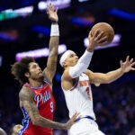 Nov 12, 2024; Philadelphia, Pennsylvania, USA; New York Knicks guard Josh Hart (3) drives for a shot in front of Philadelphia 76ers guard Kelly Oubre Jr. (9) during the second quarter at Wells Fargo Center.