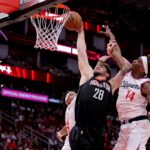 Nov 13, 2024; Houston, Texas, USA; Houston Rockets center Alperen Sengun (28) dunks against LA Clippers guard Terance Mann (14) during the fourth quarter at Toyota Center. Mandatory Credit: Erik Williams-Imagn Images