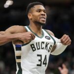 Nov 13, 2024; Milwaukee, Wisconsin, USA; Milwaukee Bucks forward Giannis Antetokounmpo (34) celebrates after scoring during overtime against the Detroit Pistons at Fiserv Forum.