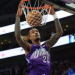Nov 14, 2024; Salt Lake City, Utah, USA; Utah Jazz forward John Collins (20) dunks the ball against the Dallas Mavericks during the first quarter at Delta Center.