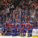 Nov 14, 2024; Edmonton, Alberta, CAN; Edmonton Oilers forward Connor McDavid (97) celebrates after scoring a goal during the second period, his 1000th NHL point against the Nashville Predators at Rogers Place. Mandatory Credit: Perry Nelson-Imagn Images
