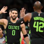 Nov 16, 2024; Boston, Massachusetts, USA; Boston Celtics forward Jayson Tatum (0) high-fives center Al Horford (42) after making a basket against the Toronto Raptors during the second half at the TD Garden.