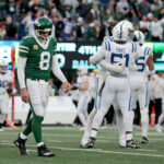 Nov 17, 2024; East Rutherford, New Jersey, USA; New York Jets quarterback Aaron Rodgers (8) walks off the field after losing to the Indianapolis Colts at MetLife Stadium. Mandatory Credit: Brad Penner-Imagn Images