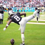 Nov 17, 2024; Miami Gardens, Florida, USA; Las Vegas Raiders running back Ameer Abdullah (8) celebrates a touchdown against the Miami Dolphins in the fourth quarter with a roundhouse kick at Hard Rock Stadium. Mandatory Credit: Jim Rassol-Imagn Images
