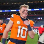 Nov 17, 2024; Denver, Colorado, USA; Denver Broncos quarterback Bo Nix (10) reacts following the win over the Atlanta Falcons at Empower Field at Mile High. Mandatory Credit: Ron Chenoy-Imagn Images