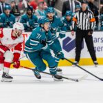 Nov 18, 2024; San Jose, California, USA; San Jose Sharks center Macklin Celebrini (71) fights for the puck during the second period against the Detroit Red Wings at SAP Center at San Jose. Mandatory Credit: Bob Kupbens-Imagn Images