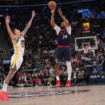 Nov 18, 2024; Inglewood, California, USA; LA Clippers guard Norman Powell (24) shoots the ball against Golden State Warriors forward Lindy Waters III (43) in the second half at Intuit Dome. Mandatory Credit: Kirby Lee-Imagn Images