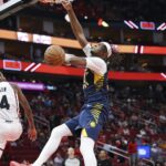 Nov 20, 2024; Houston, Texas, USA; Indiana Pacers center Myles Turner (33) dunks the ball as Houston Rockets guard Jalen Green (4) defends during the third quarter at Toyota Center. Mandatory Credit: Troy Taormina-Imagn Images