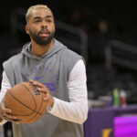 Nov 21, 2024; Los Angeles, California, USA; Los Angeles Lakers guard D'Angelo Russell (1) warms up prior to the game against the Orlando Magic at Crypto.com Arena.